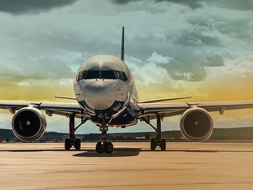 Front view of a private jet on the runway